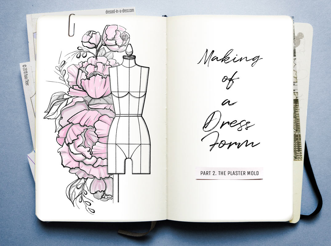 Open Notebook Pages with a dress form and flowers drawing